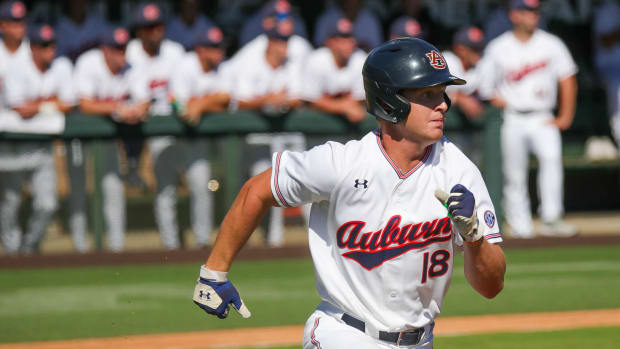 Auburn freshman Ike Irish checks on his home run ball against Louisiana Tech in fall exhibition action